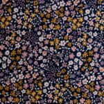 tela de la colección poppy con florecitas en colores y fondo azul marino