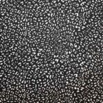 Tela Viscosa Fondo Negro con Manchas Blancas Animal Print